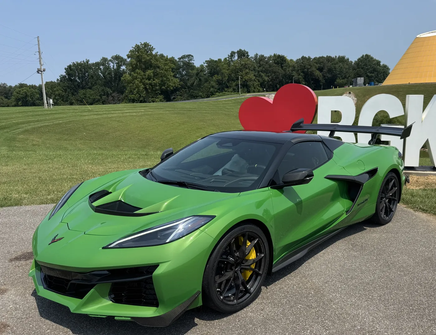 A green Corvette ZR1 in front of the BGKY sign and the museum Skydome