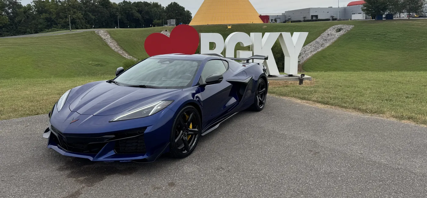 A gray Corvette Stingray parked on the National Corvette Museum grounds