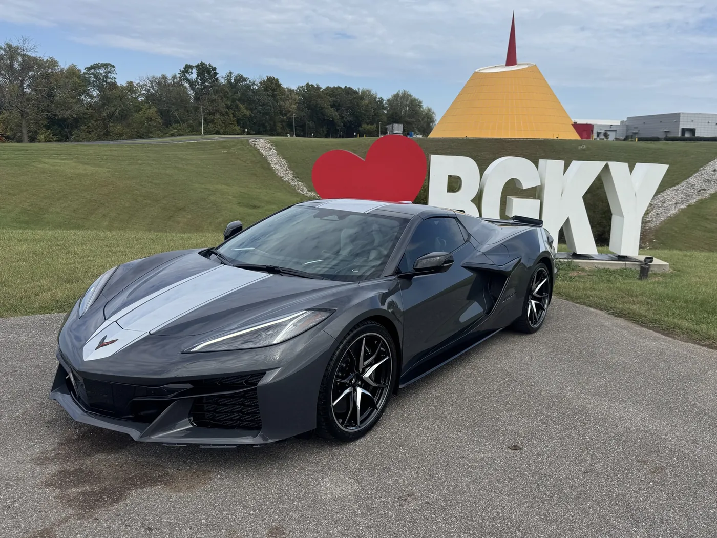 Gray Corvette front end with a white stripe inside the museum