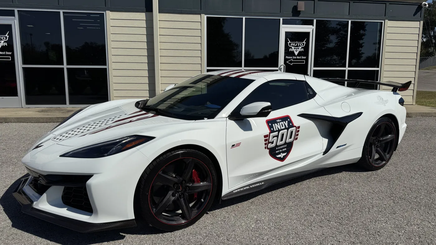 A white Corvette Z06 at the Auto Armor shop with its side scoop outlined in red